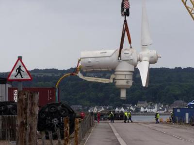 Tidal turbine being raised by a crane